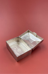 Silver jewelry box on a red background